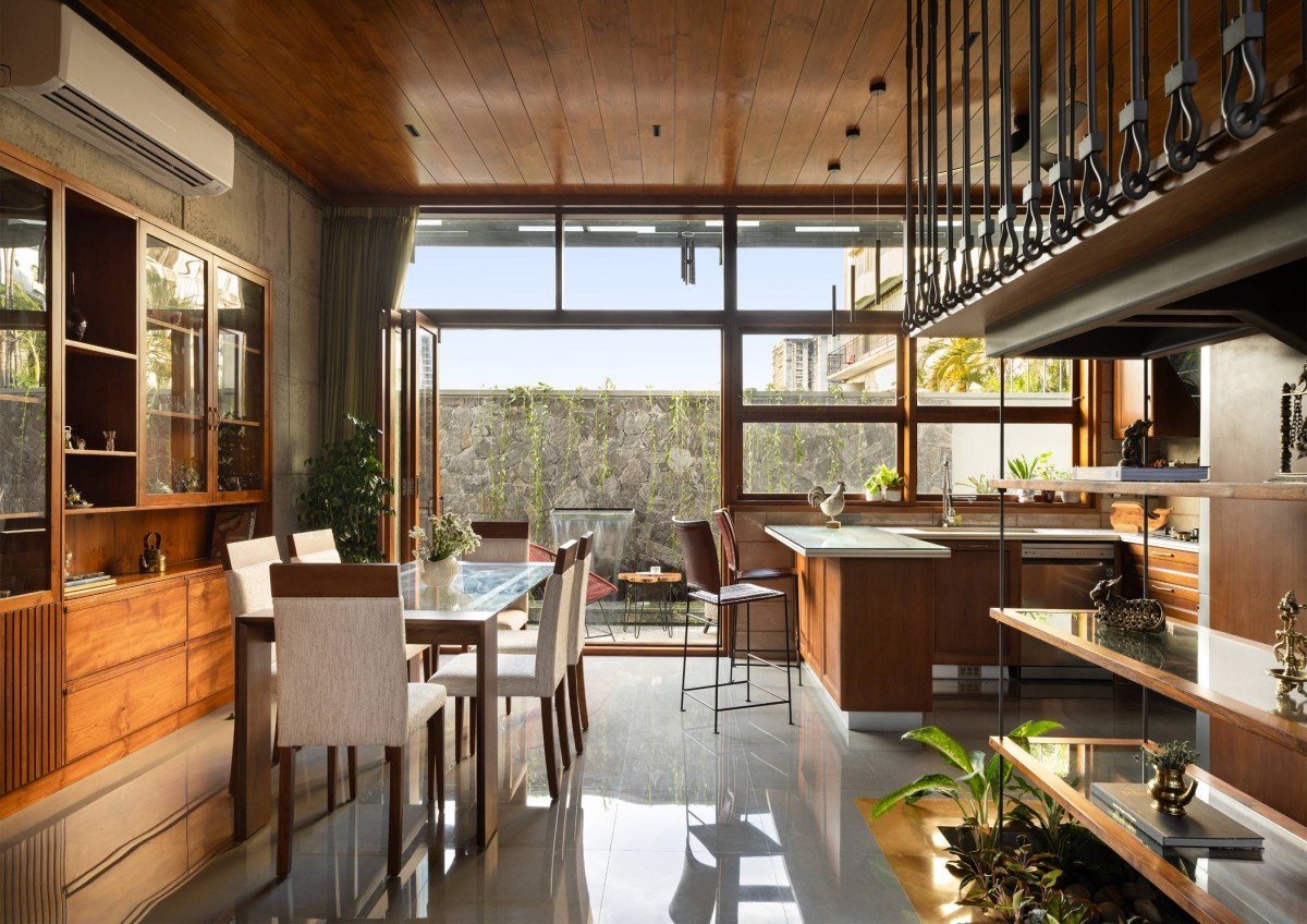 Dining and Kitchen of Carving a COURT OF QUIETUDE in a Bustling Cityscape by Mudbricks Architects