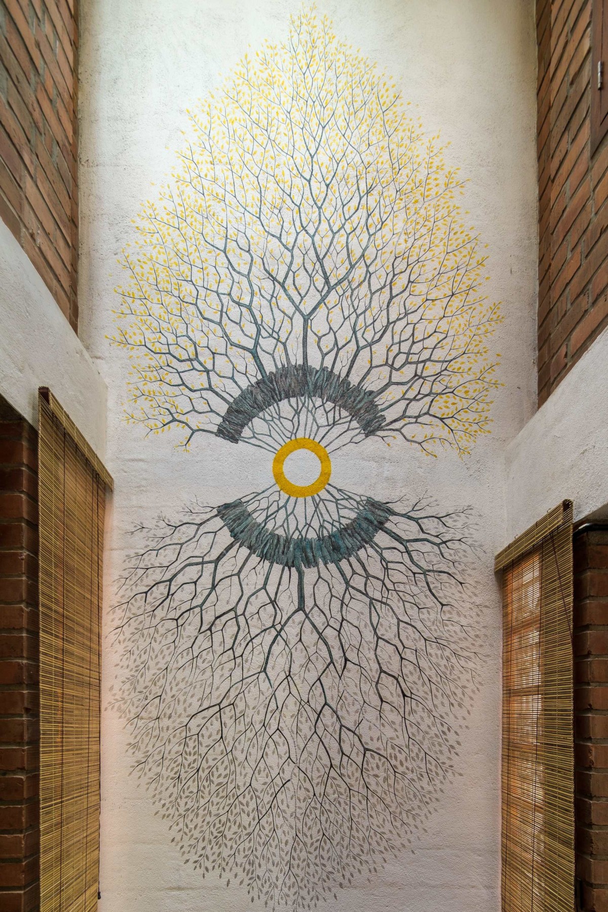 Wall art at courtyard of Idam- A house that calls back by Ishtika Design Studio