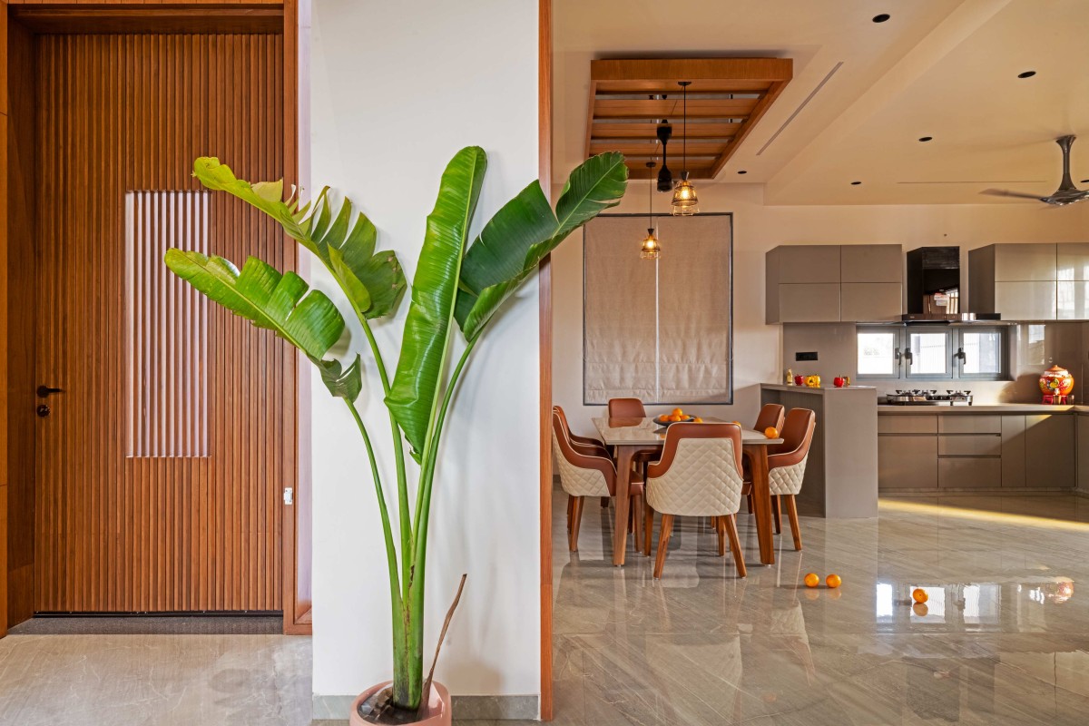 Dining and Kitchen of Ananta Bungalow by Kalajeet Architects