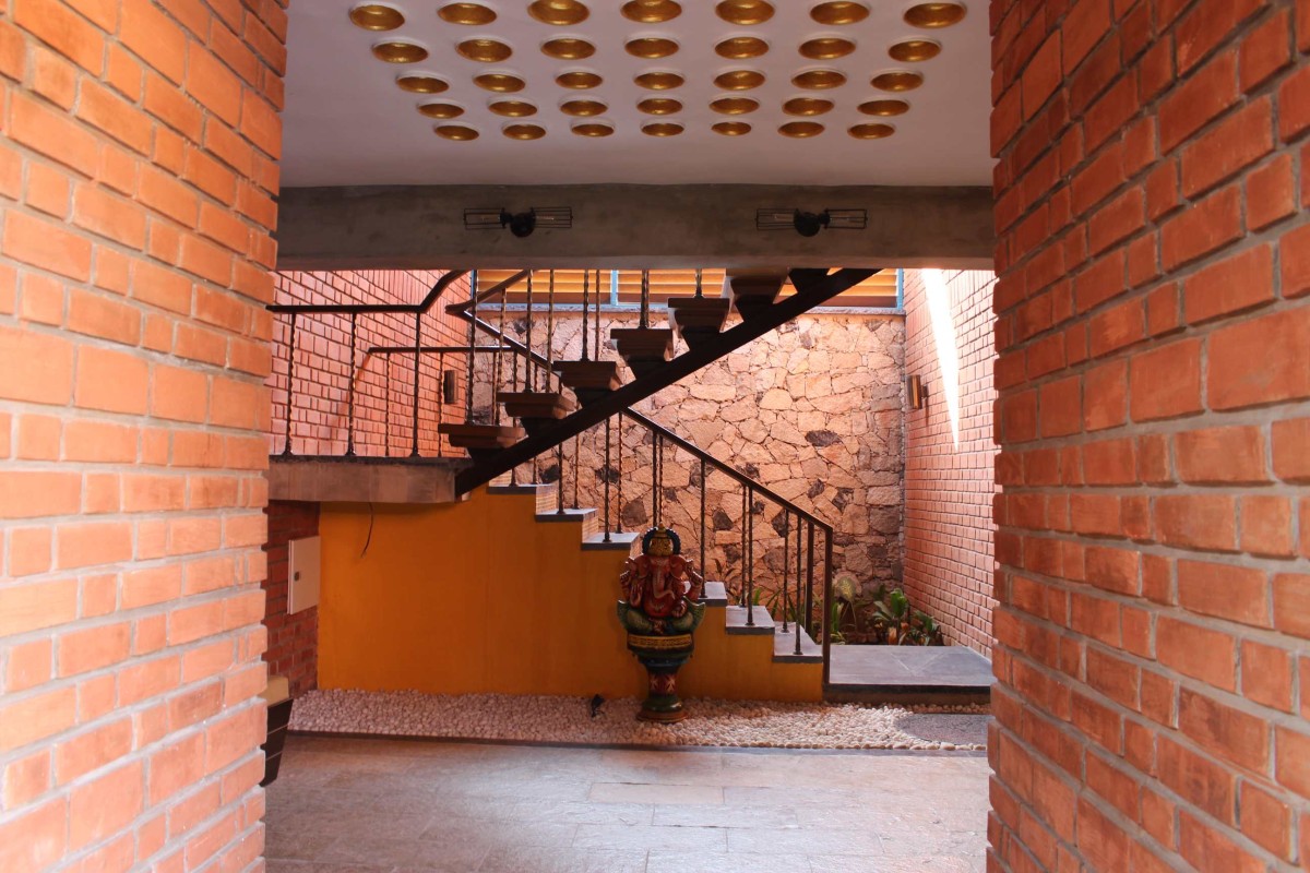 Passage to staircase of Vashi Farm House by d6thD Design Studio