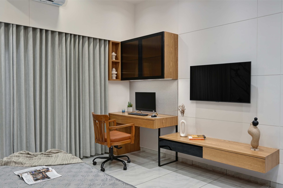 Master Bedroom, Study area and TV unit of Humble Abode by Woodpeckers Studio