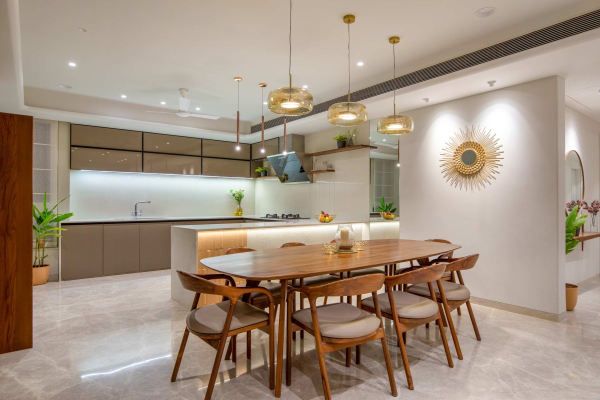 Dining Area and Kitchen of Popat's House by JNM Space Creators LLP