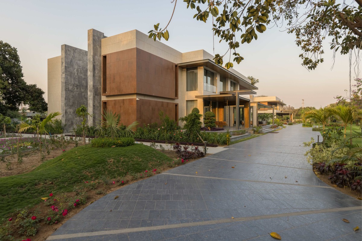 Exterior view of left house of Narola Villa by Essteam Design Services LLP