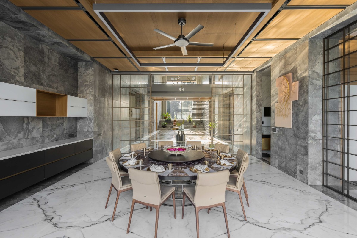 Dining area of right house of Narola Villa by Essteam Design Services LLP