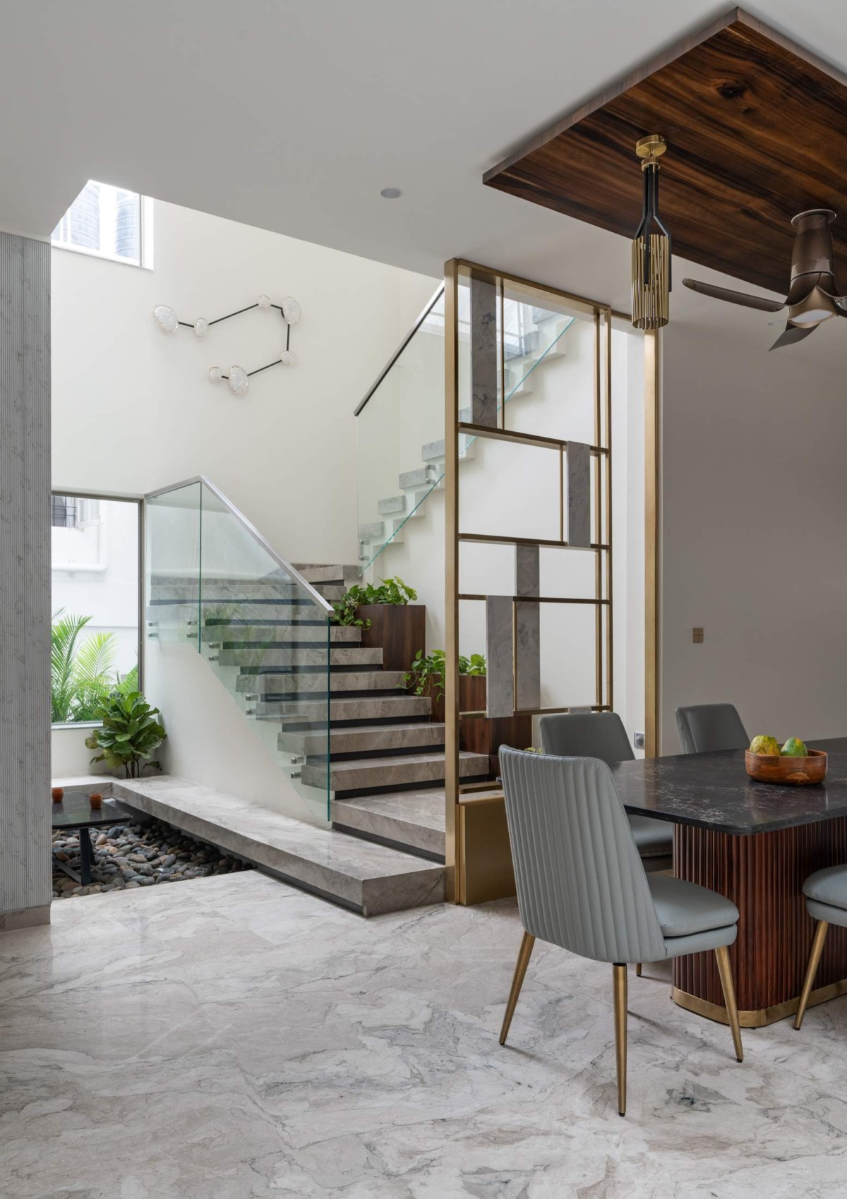 Dining to Staircase view of S145 House by The InsideOut Studio