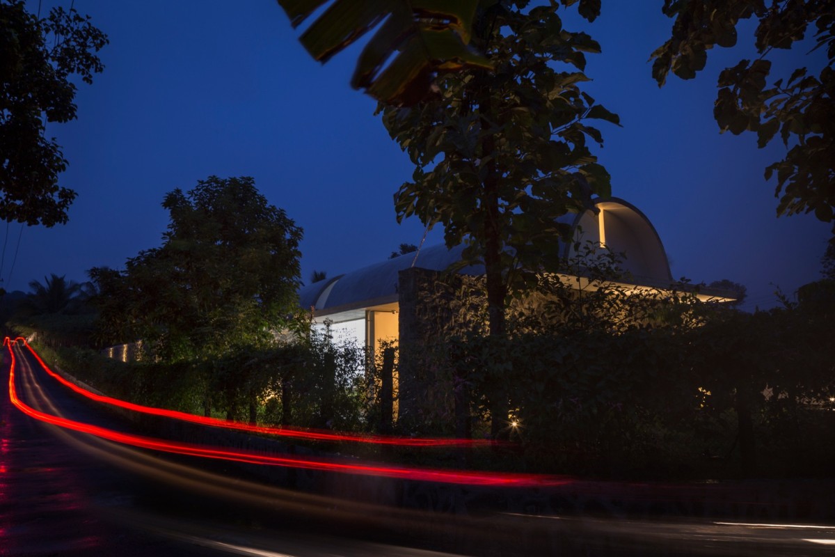 Dusk light exterior view of The Walls and Vaults House by LIJO.RENY.architects