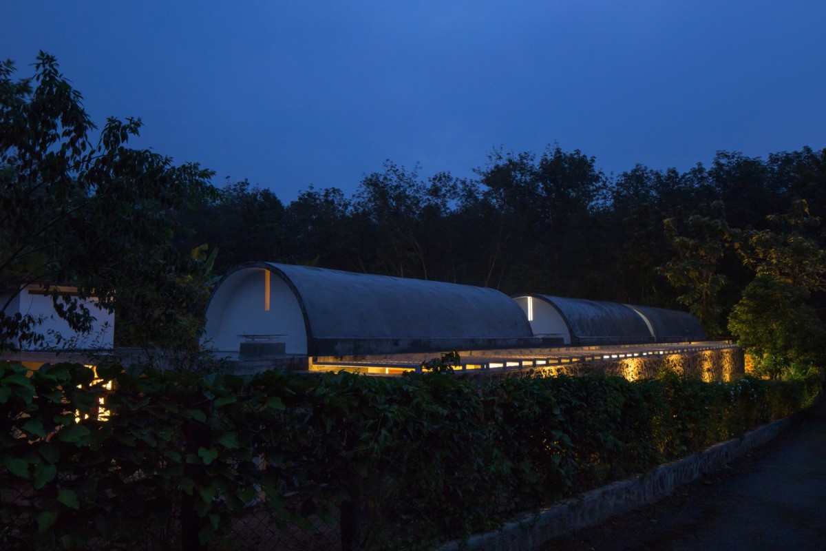 Dusk light exterior view of The Walls and Vaults House by LIJO.RENY.architects