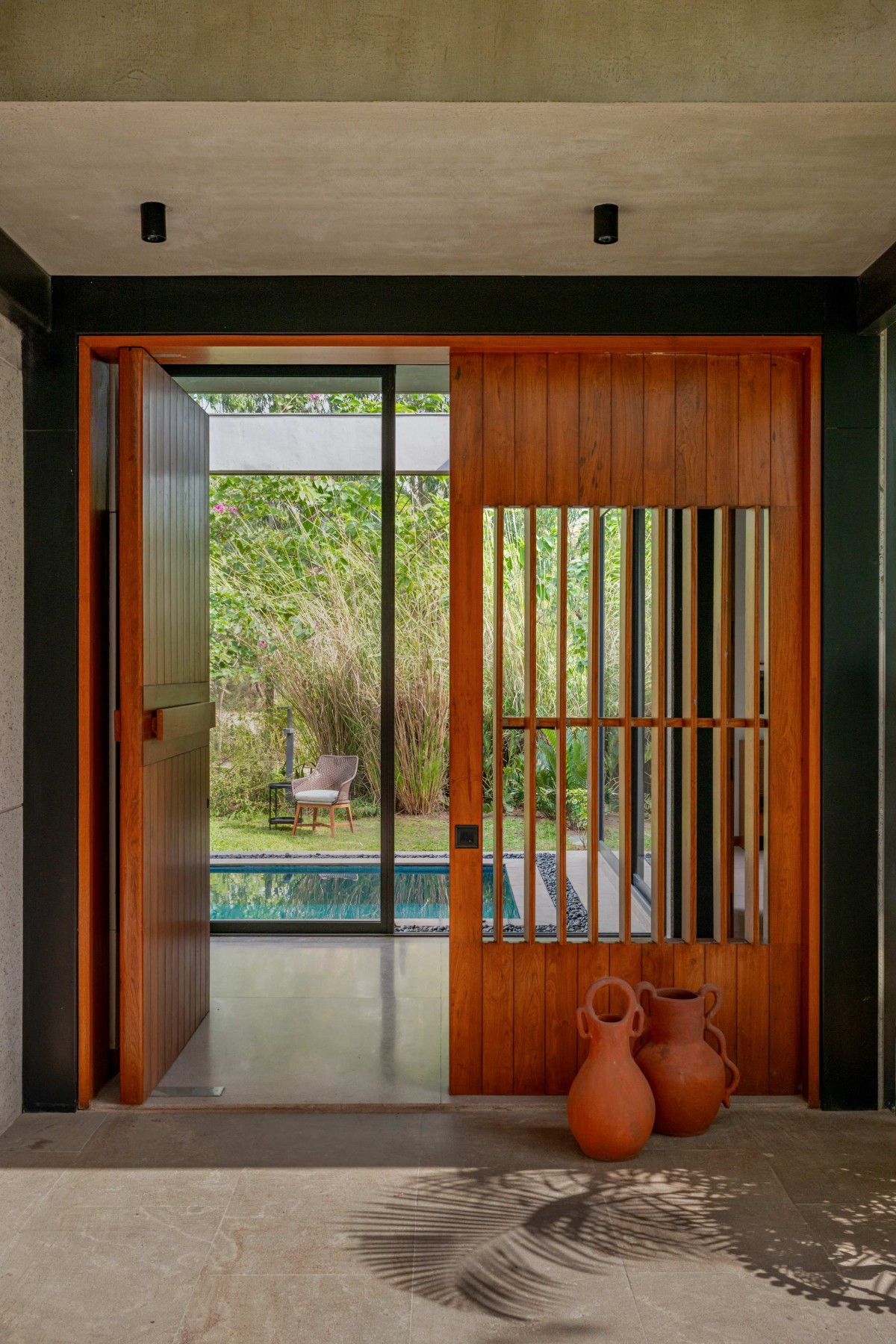 Entry of House in Woods by Anarr Gunjaria Interiors