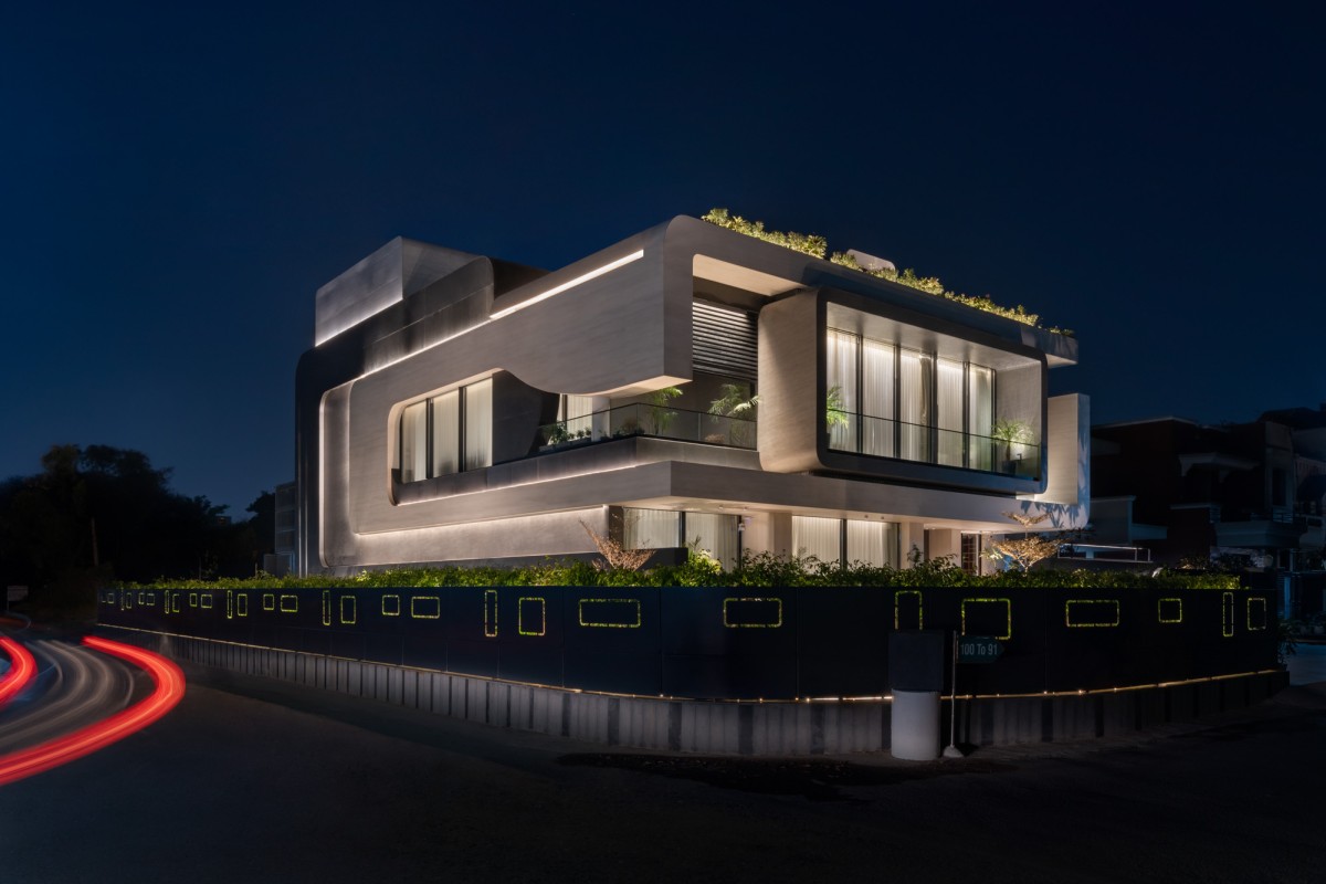 Dusk light exterior view of Residence 100 by Subash and Associates