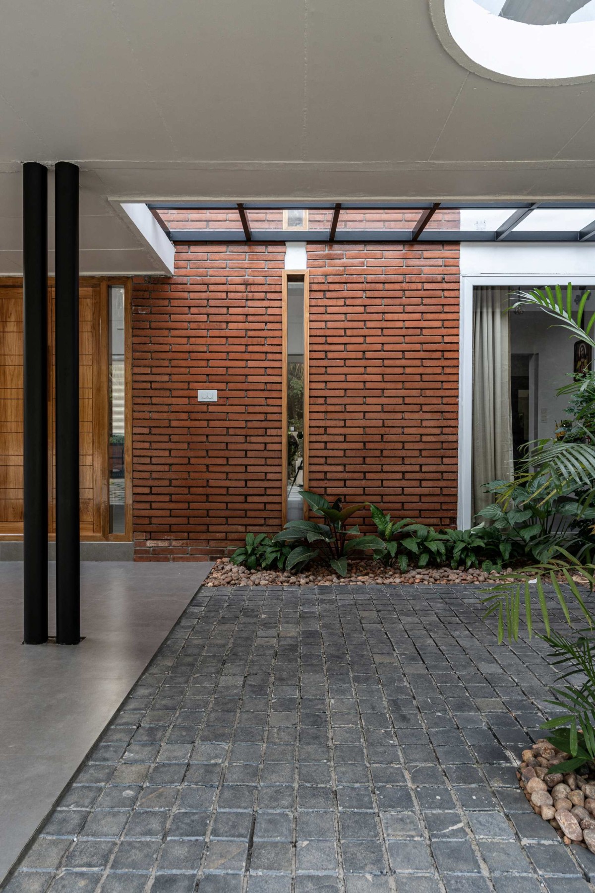 Outdoor Court of Brock House by Akhil Albin Architects