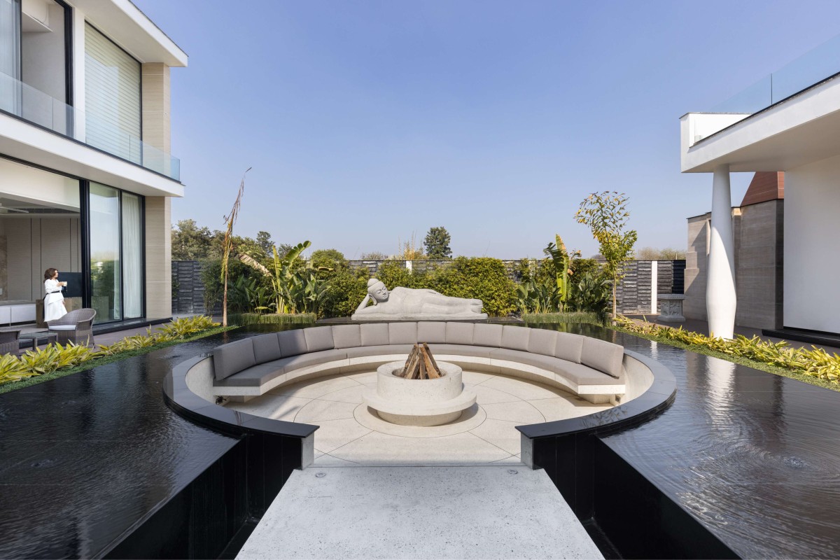 Sunken seating area with waterbody of Ananda by 23DC Architects