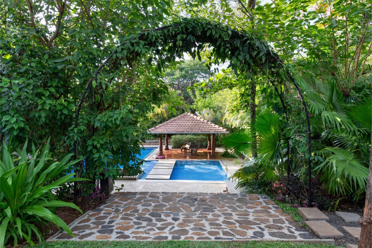 Entry to pool area of A Farmhouse At Mahiravani by Environ Planners