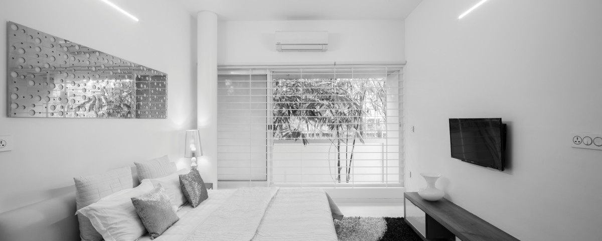 Ground Floor Master Bedroom of The Floating Parasol House by LIJO.RENY.architects