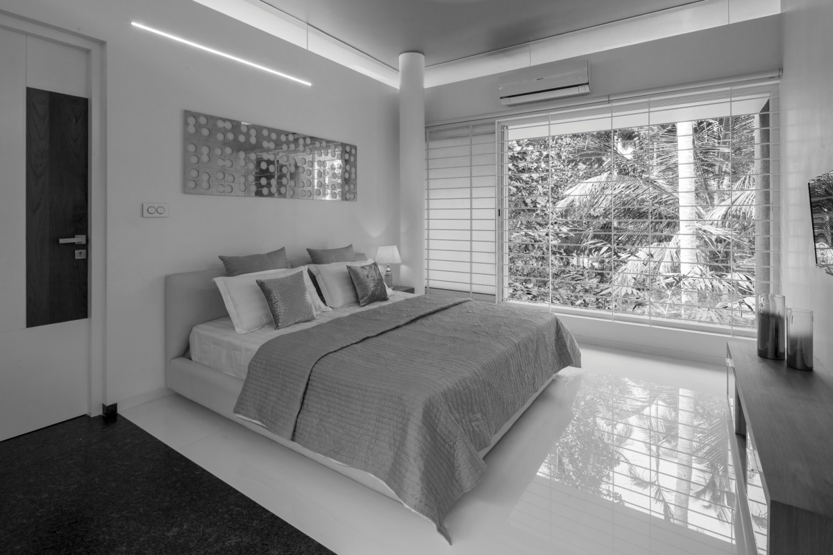 First Floor Master Bedroom of The Floating Parasol House by LIJO.RENY.architects