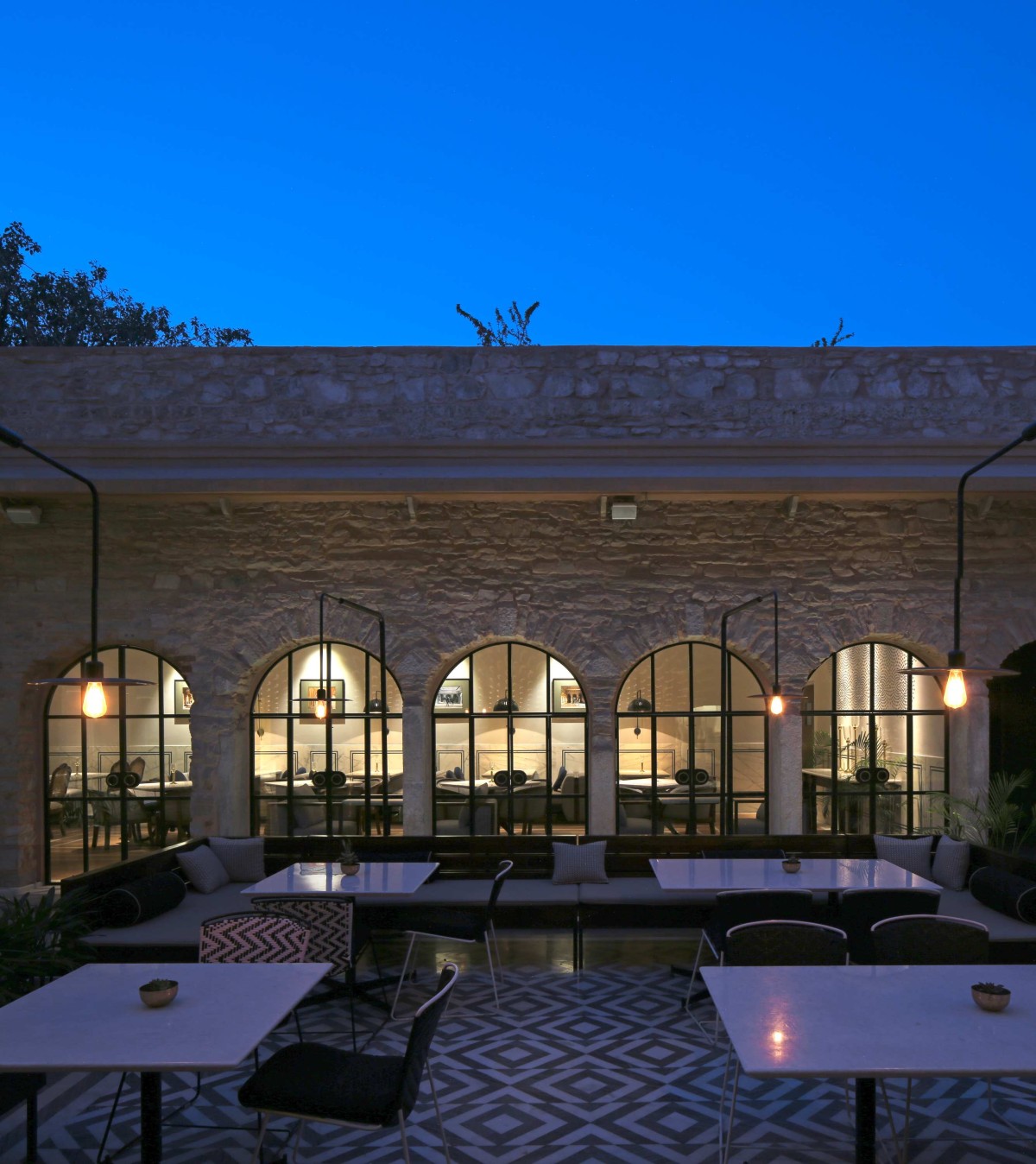 Night shot of courtyard seating of Baradari by Studio Lotus