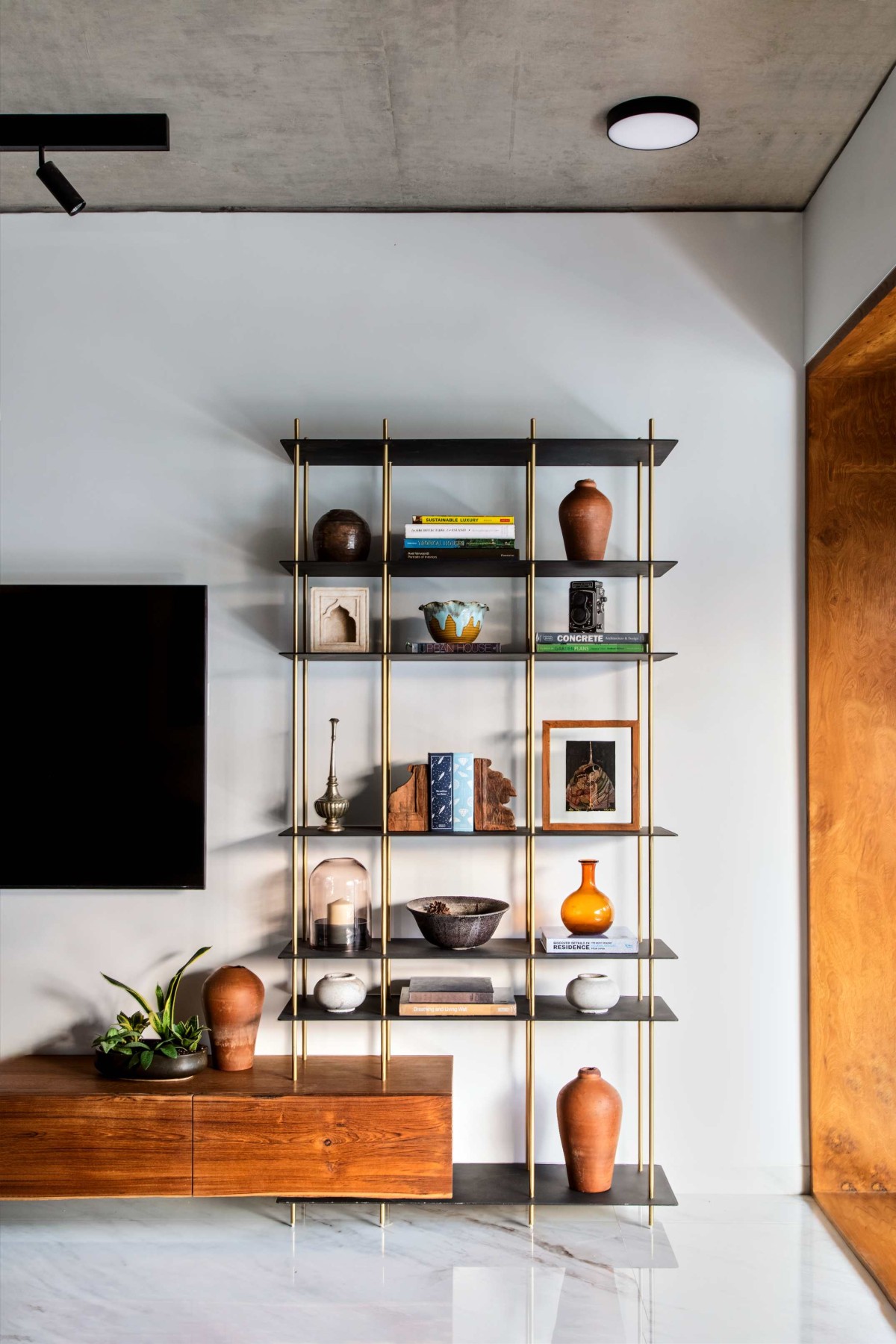 TV Unit of Brass Wall House by Studio Lagom