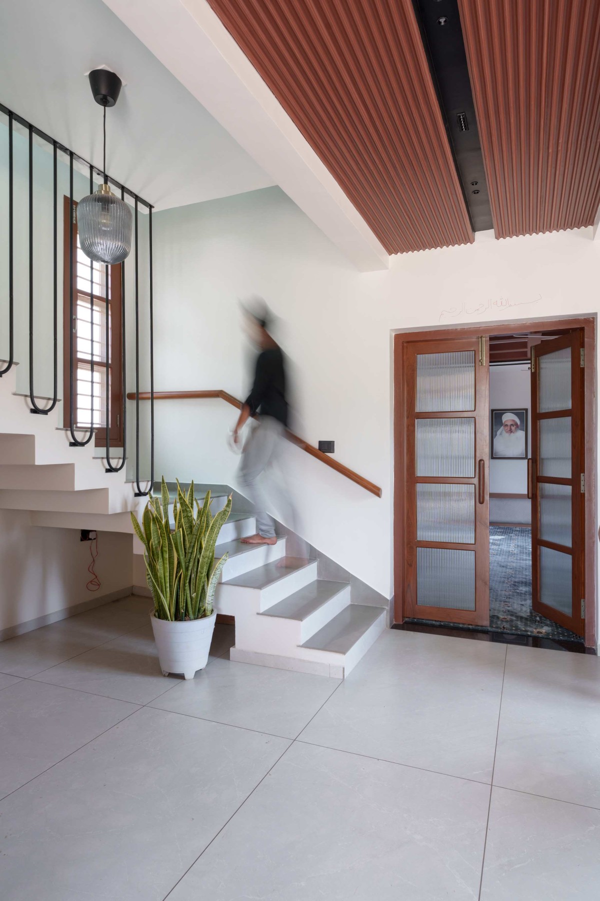 Passage to staircase of Brick Abode by D.I.B Collaborative