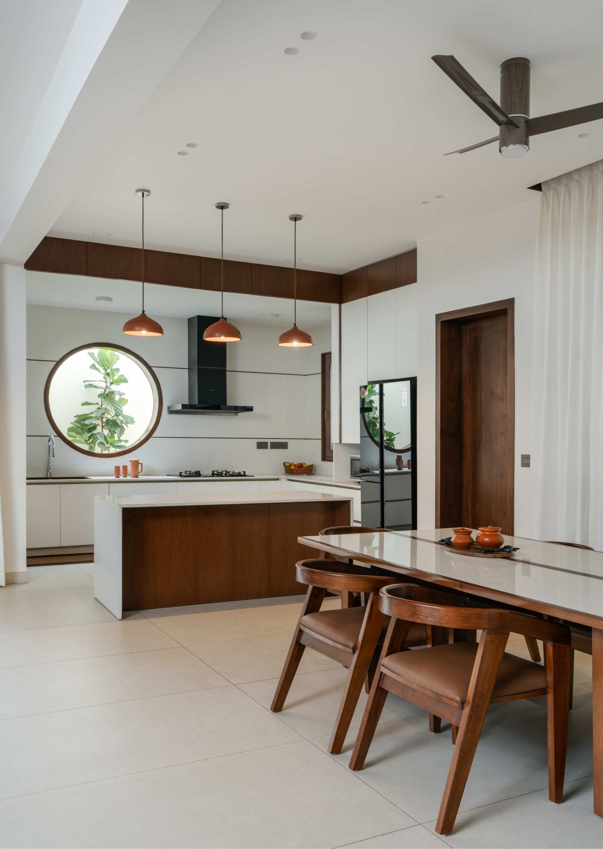 Dining & Kitchen of Tanish by Jyaamiti Architectural Studio