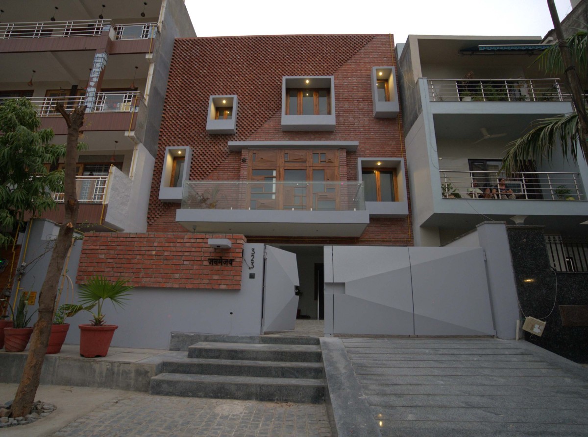 Dusk light exterior view of The Box House by OM Architects