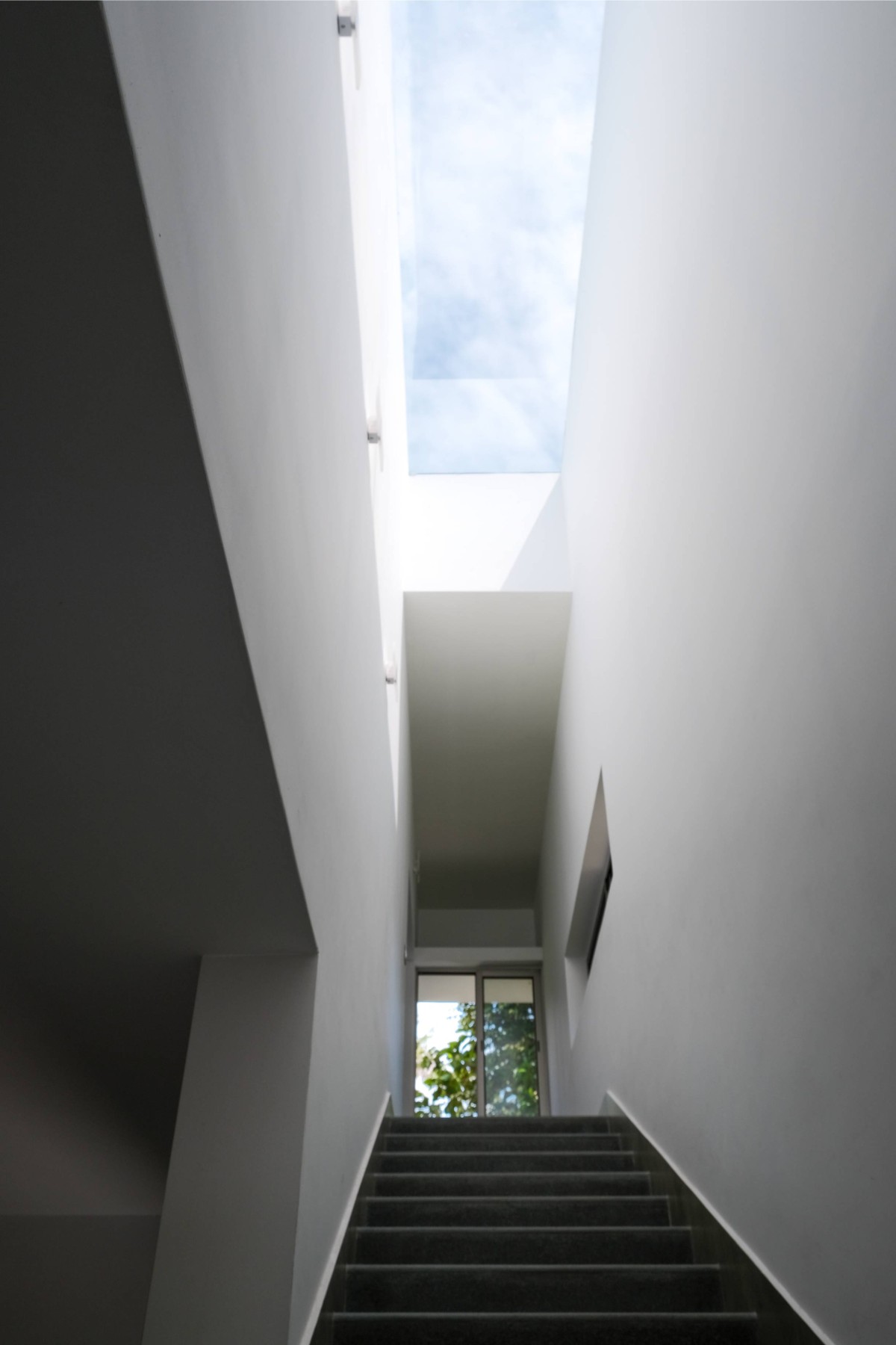 Staircase view of The Monolithic House by The Design Pursuit