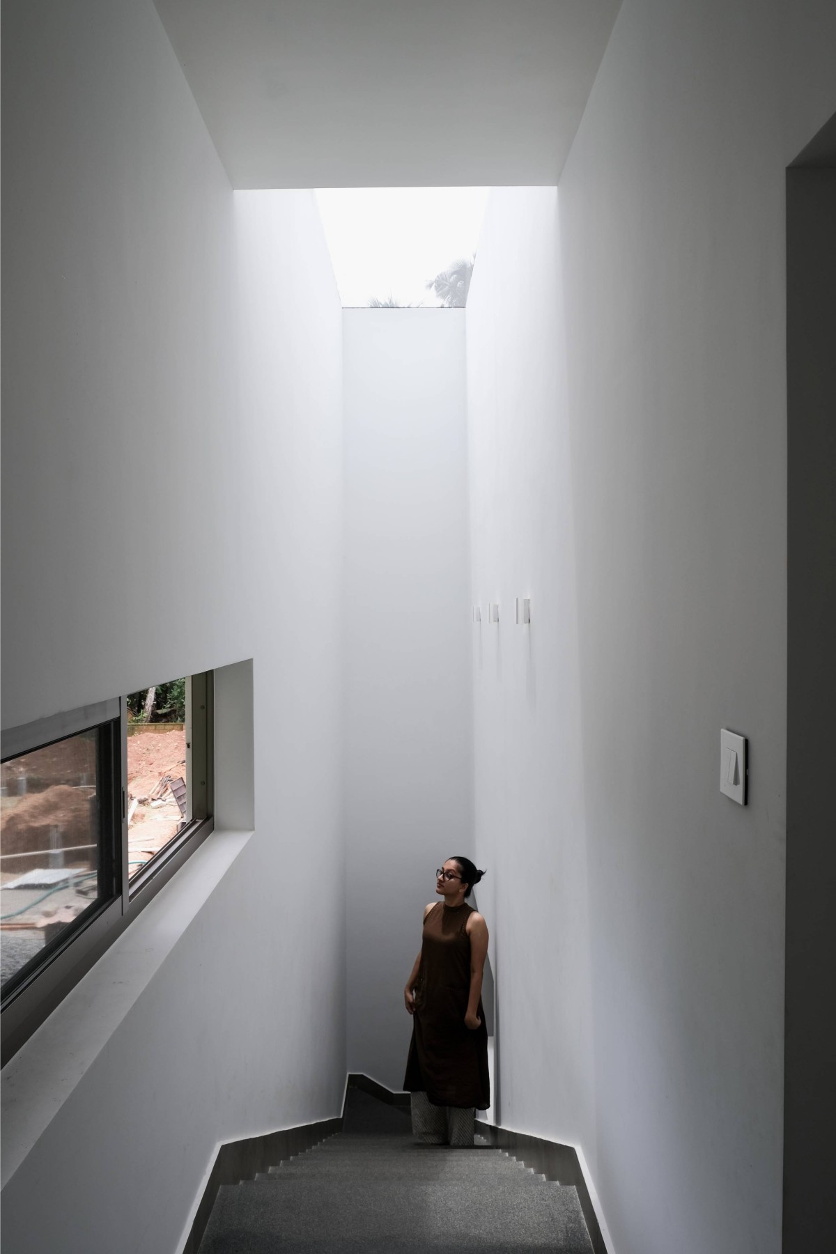 Staircase view of The Monolithic House by The Design Pursuit