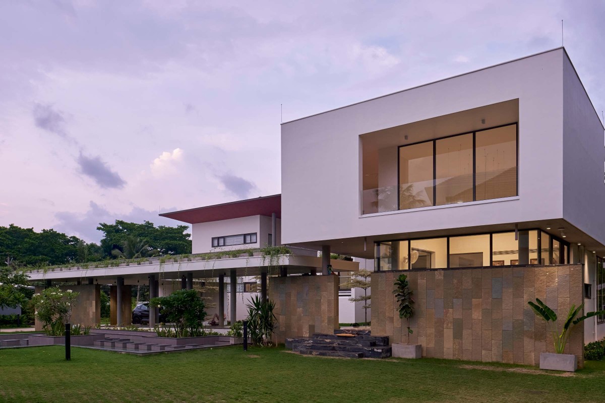 Dusk light exterior view of Payyavoor House by SOHO Architects