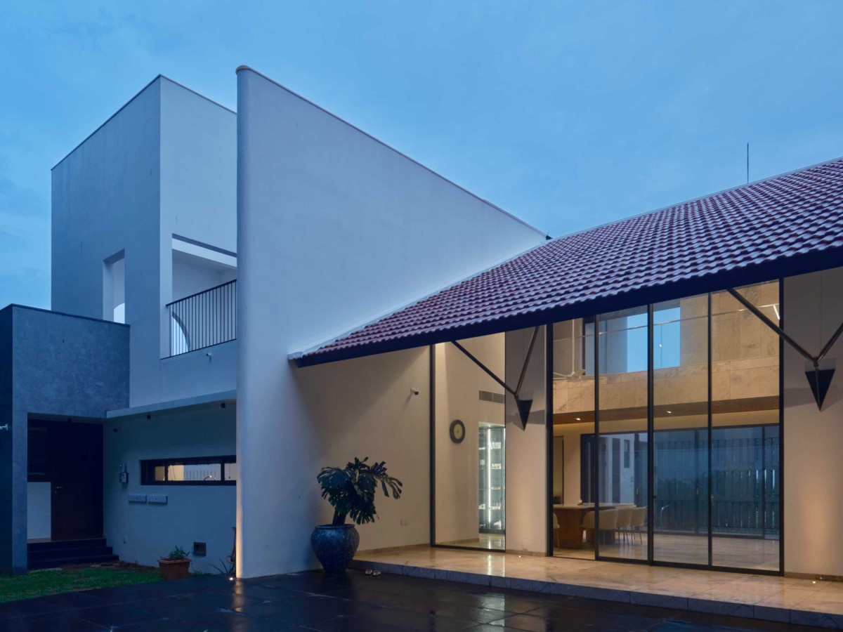 Dusk light exterior view of Mathamangalam House by SOHO Architects