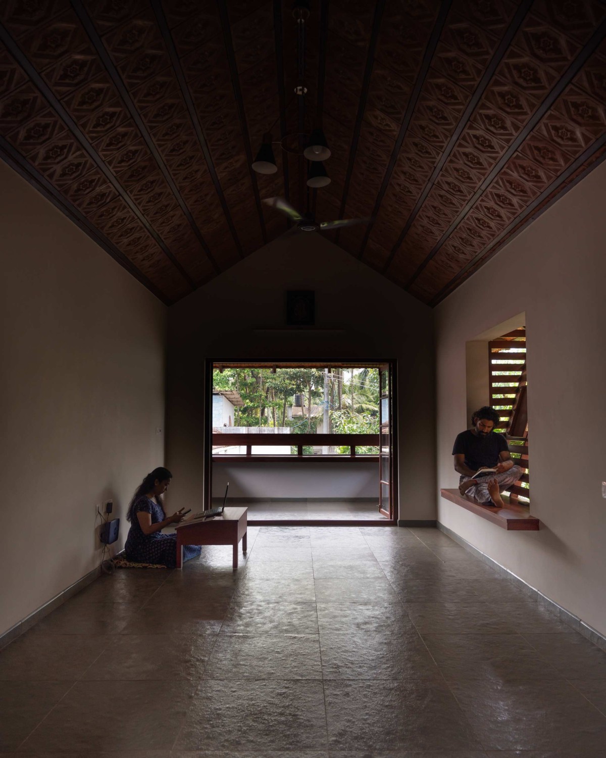 Upper floor living with balcony of Kaloor Residence by VSP Architects