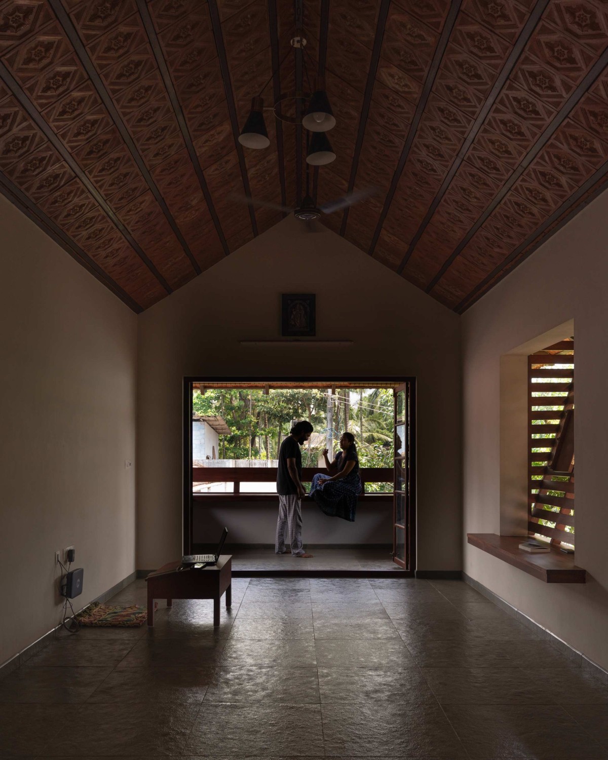 Upper floor living with balcony of Kaloor Residence by VSP Architects