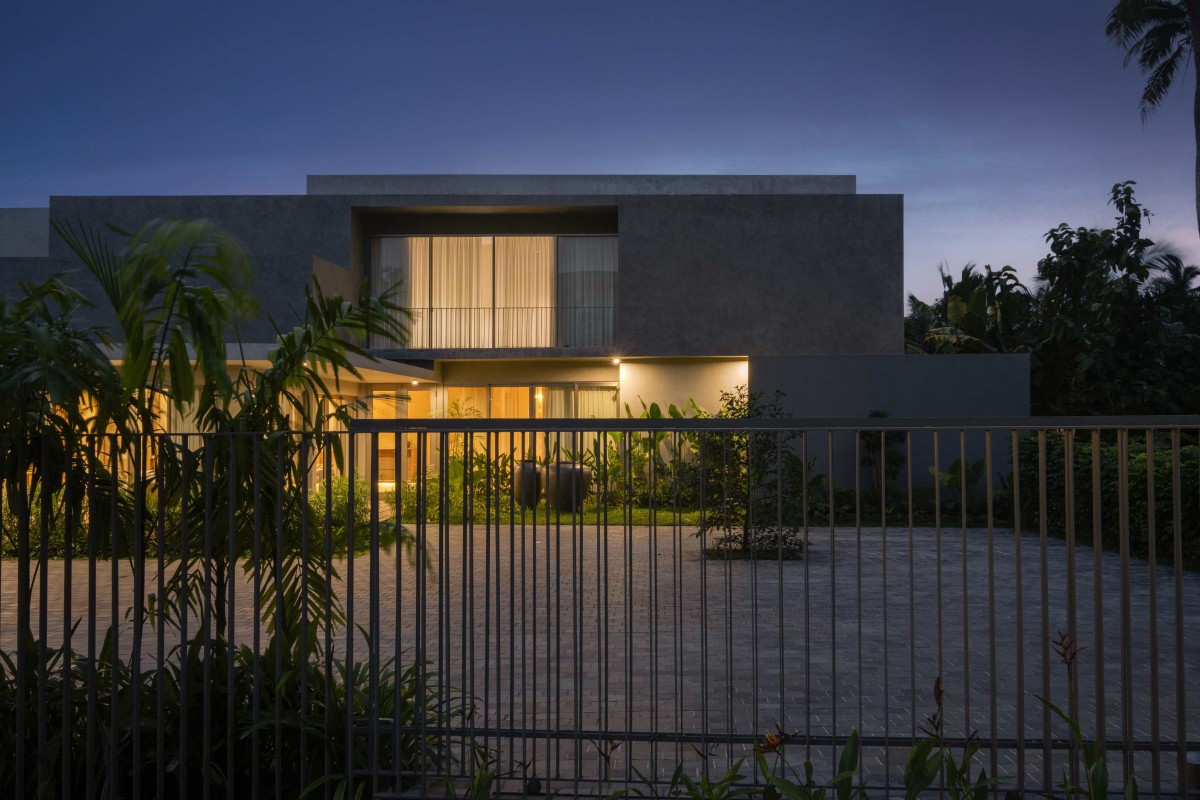 Dusk light exterior view of Maison Gris by Sabs Architects