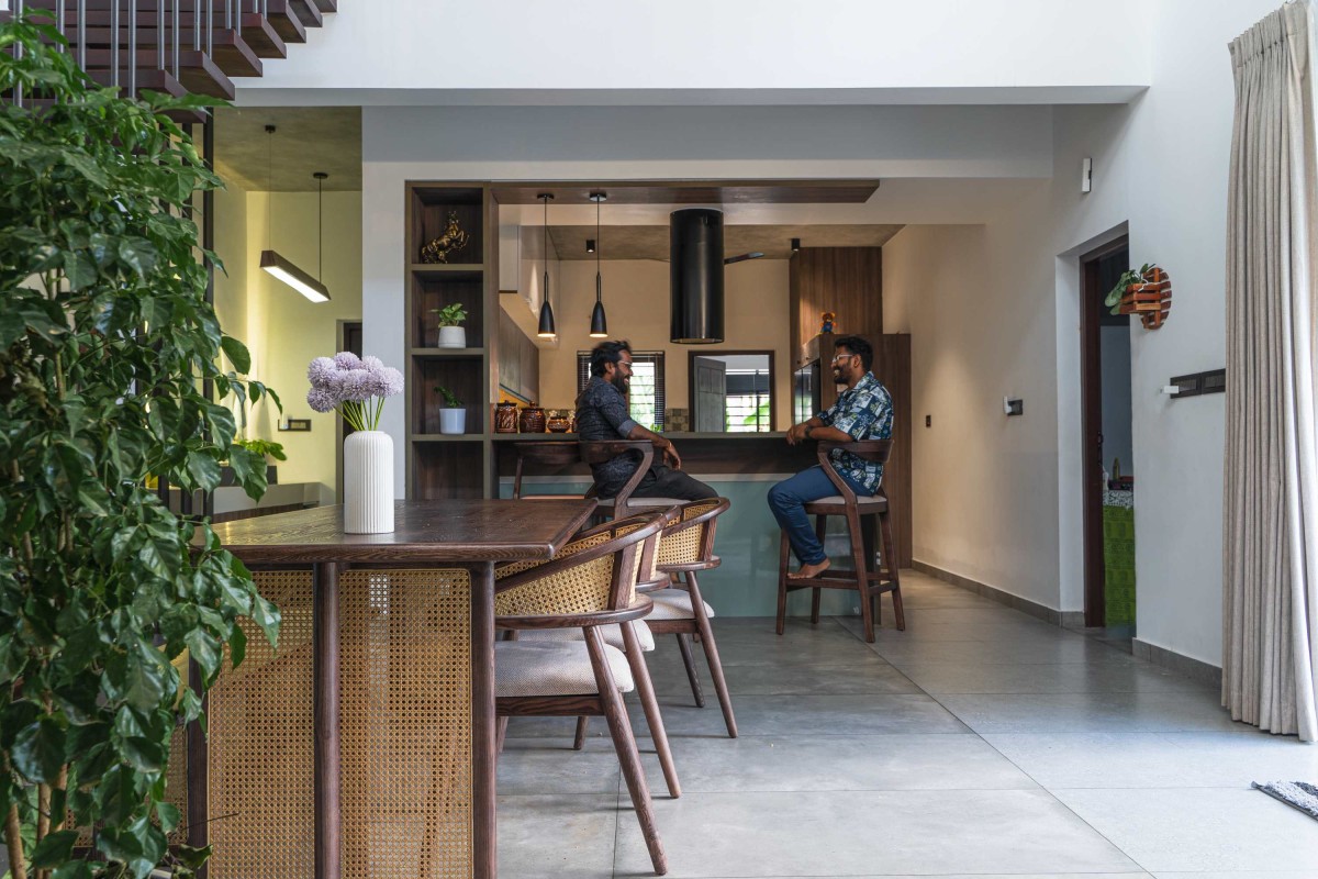 Dining to Kitchen view of Ikebana Residence by Mayaa Studio