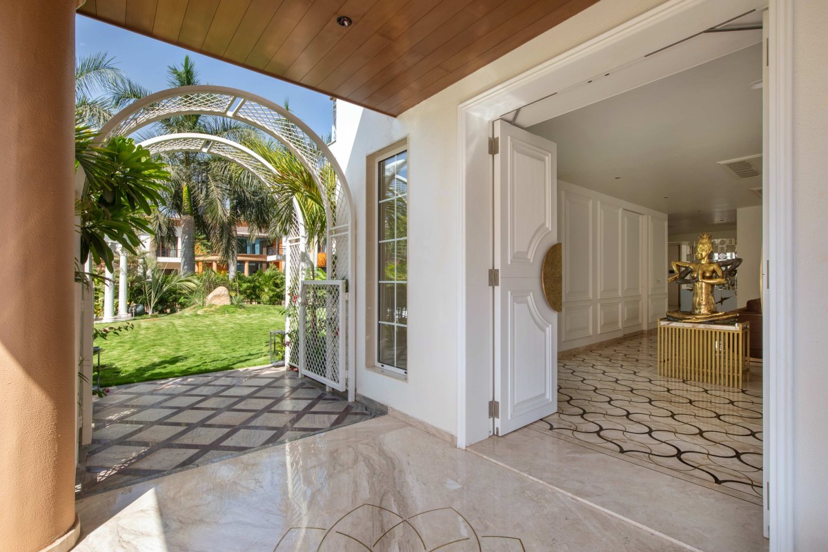 Porch & Garden view of The Classic Dwelling by K.N. Associates