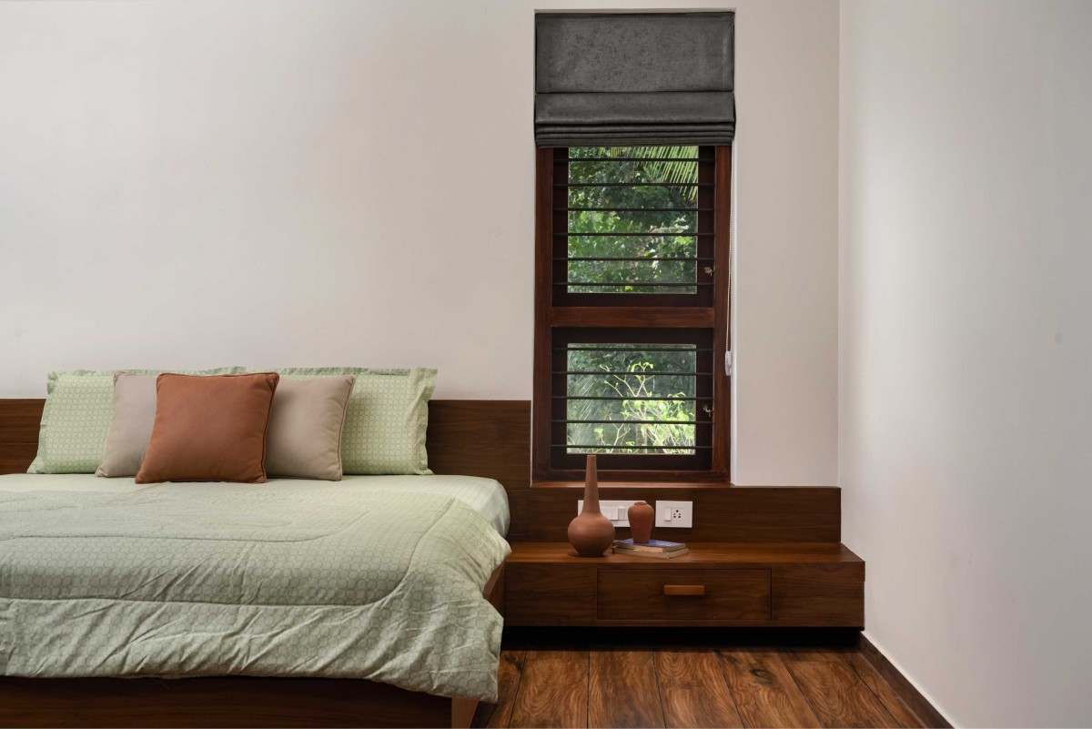 Bedroom 2 of House Beneath a Jackfruit Tree by Uru Consulting LLP