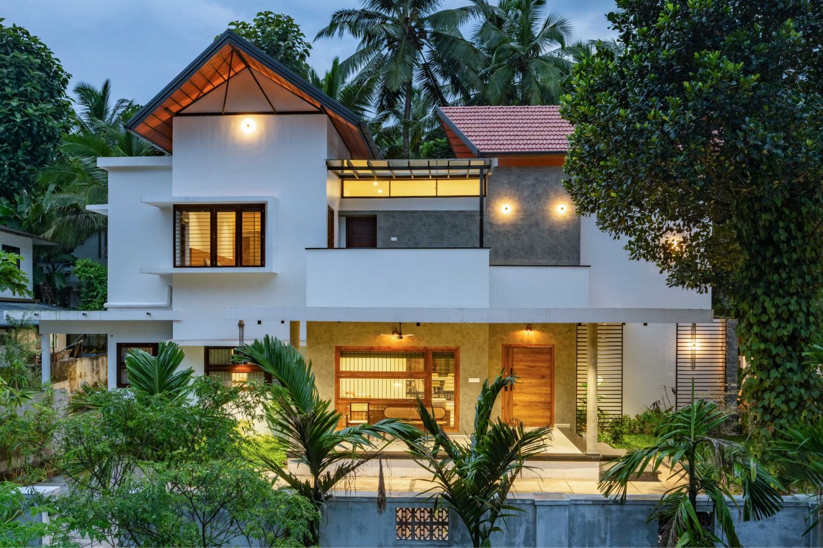 Dusk light exterior view of House Beneath a Jackfruit Tree by Uru Consulting LLP