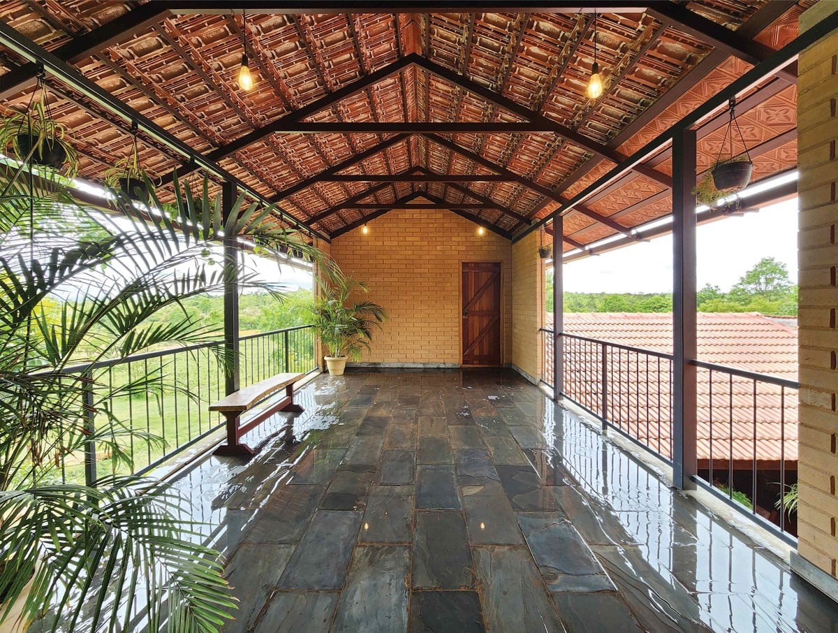 Semi covered space of Earthy House by Interface Architects Studio