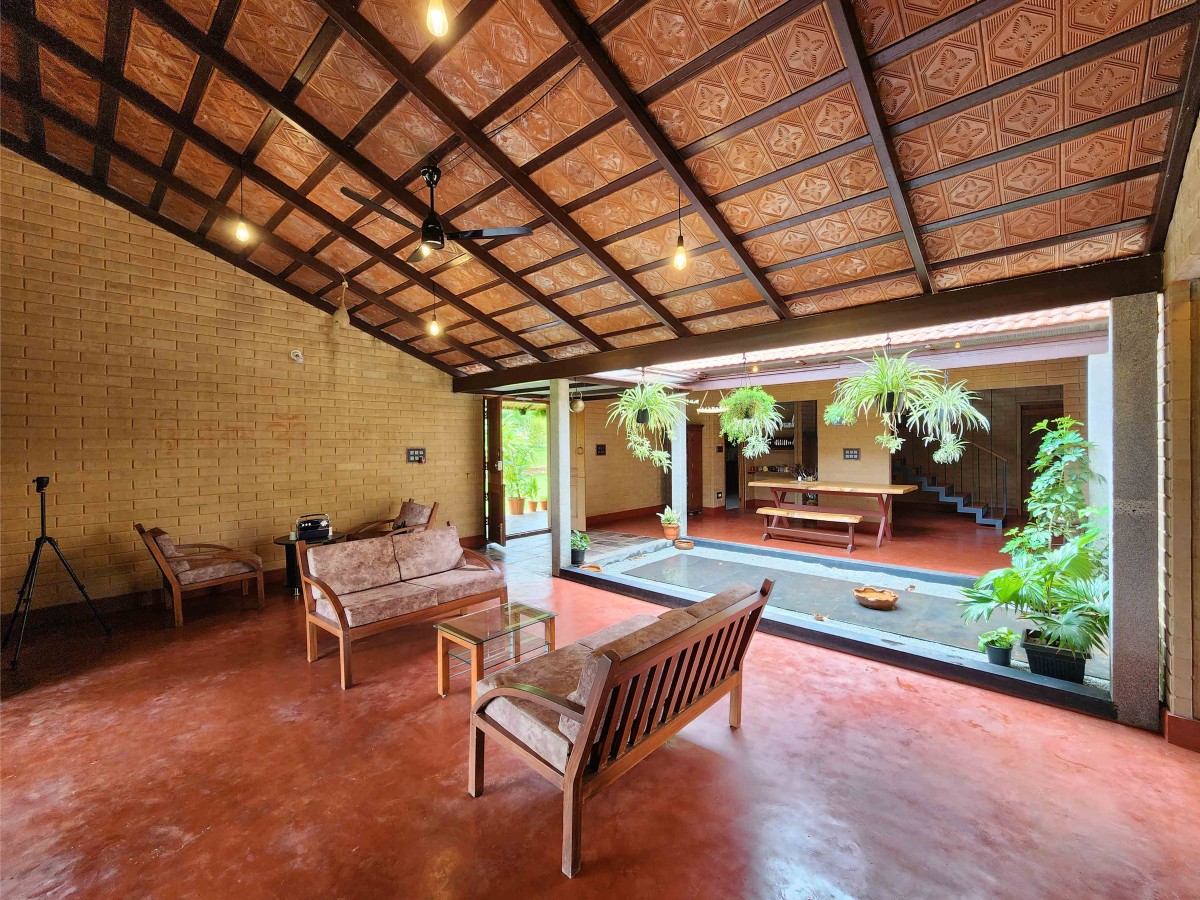 Living area of Earthy House by Interface Architects Studio