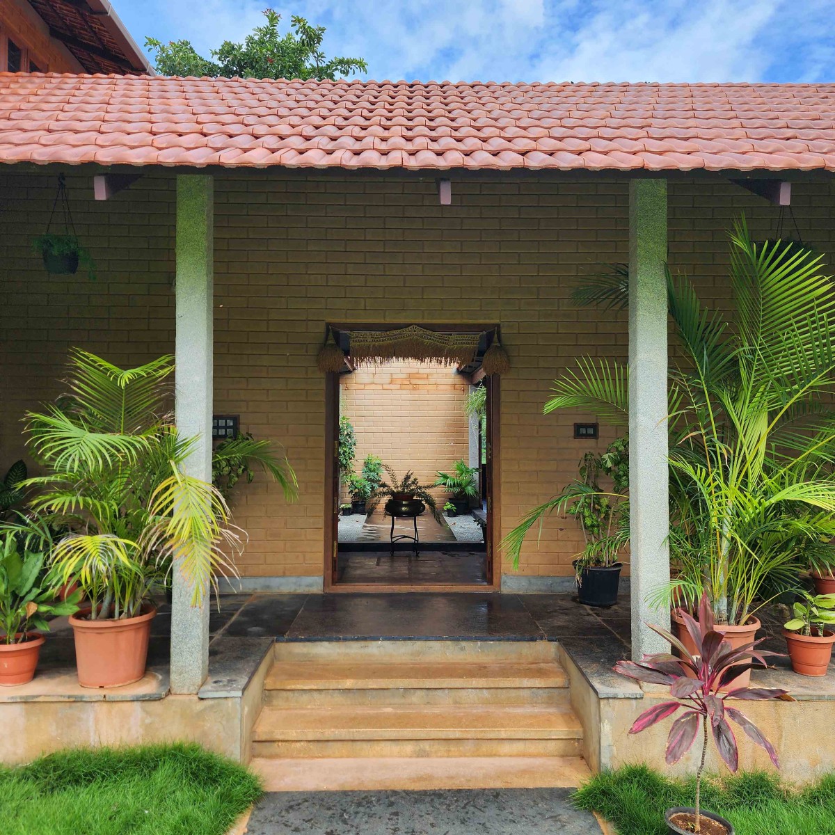 Entrance of Earthy House by Interface Architects Studio