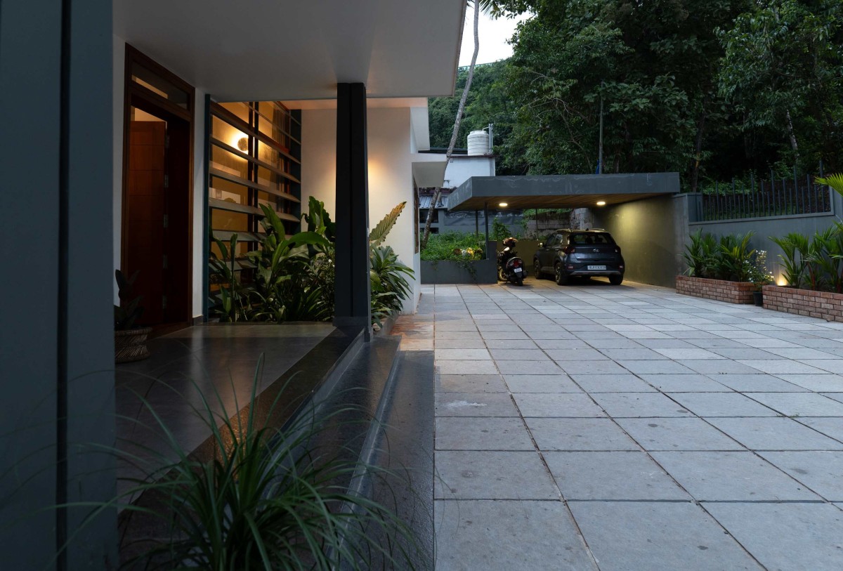 Entry Porch & Parking of The Cube by Nestcraft Architecture