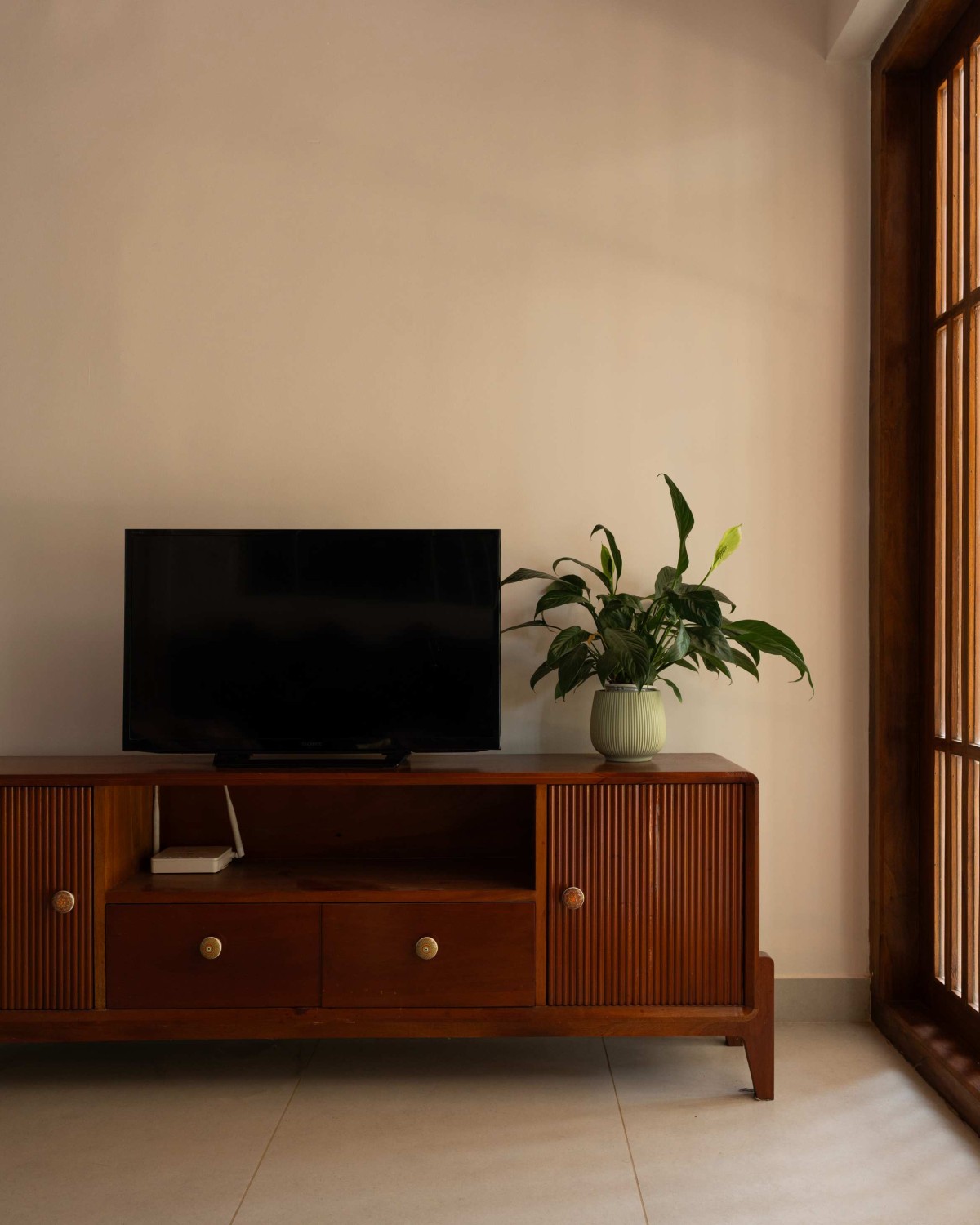 TV Unit of Kanjirakol House by Space Narratives