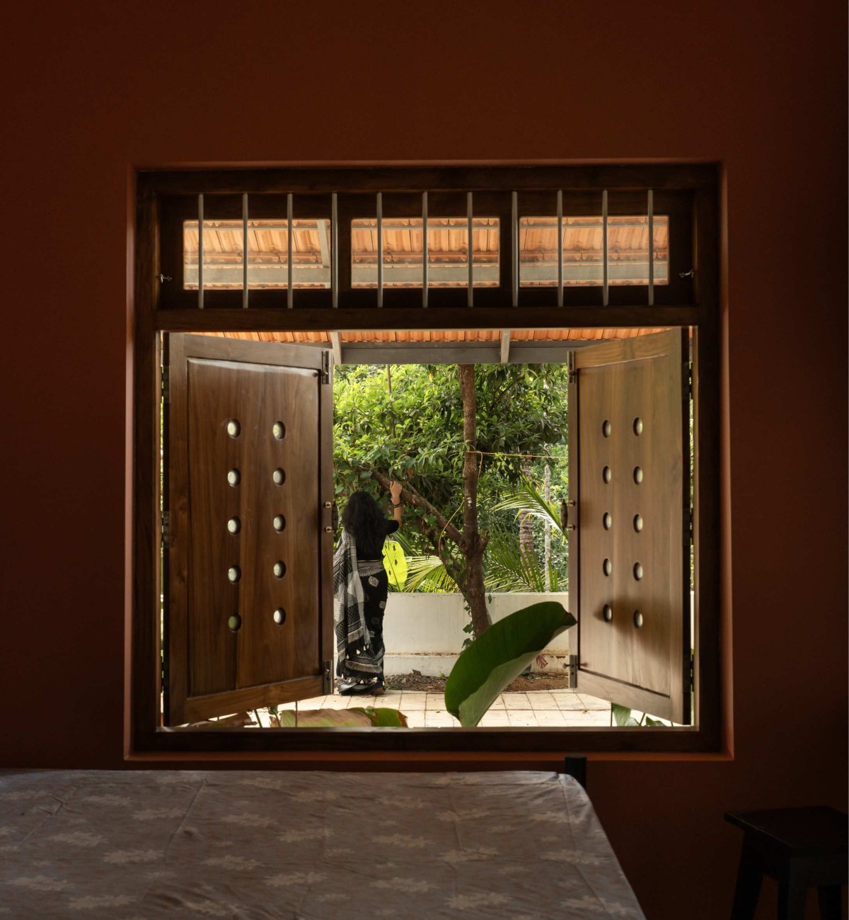 Bedroom window of Kanjirakol House by Space Narratives