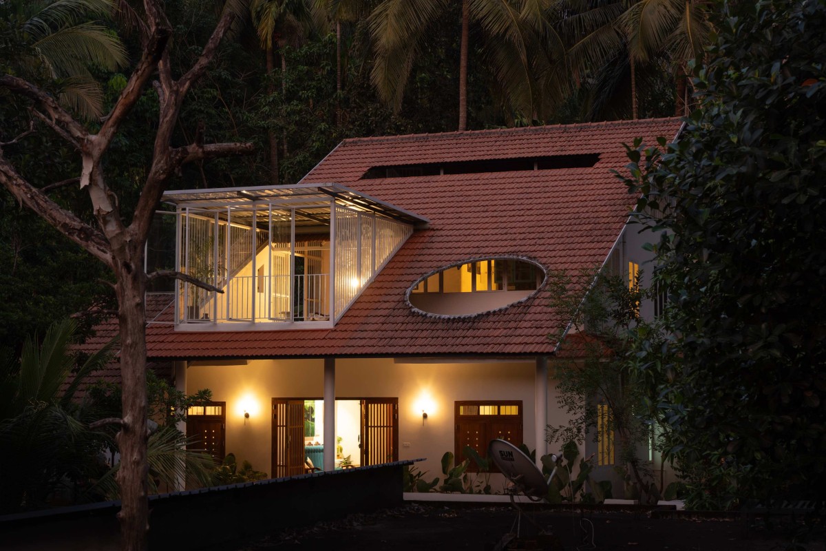 Dusk light exterior view of Kanjirakol House by Space Narratives
