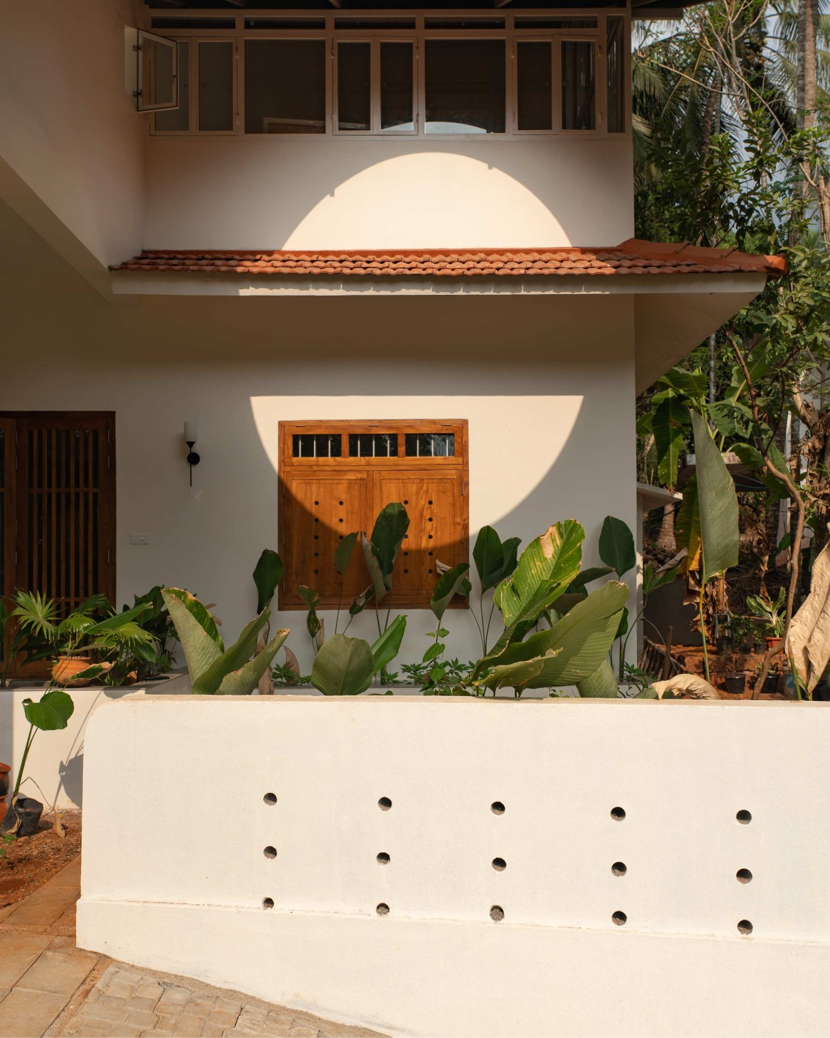 Exterior view of Kanjirakol House by Space Narratives