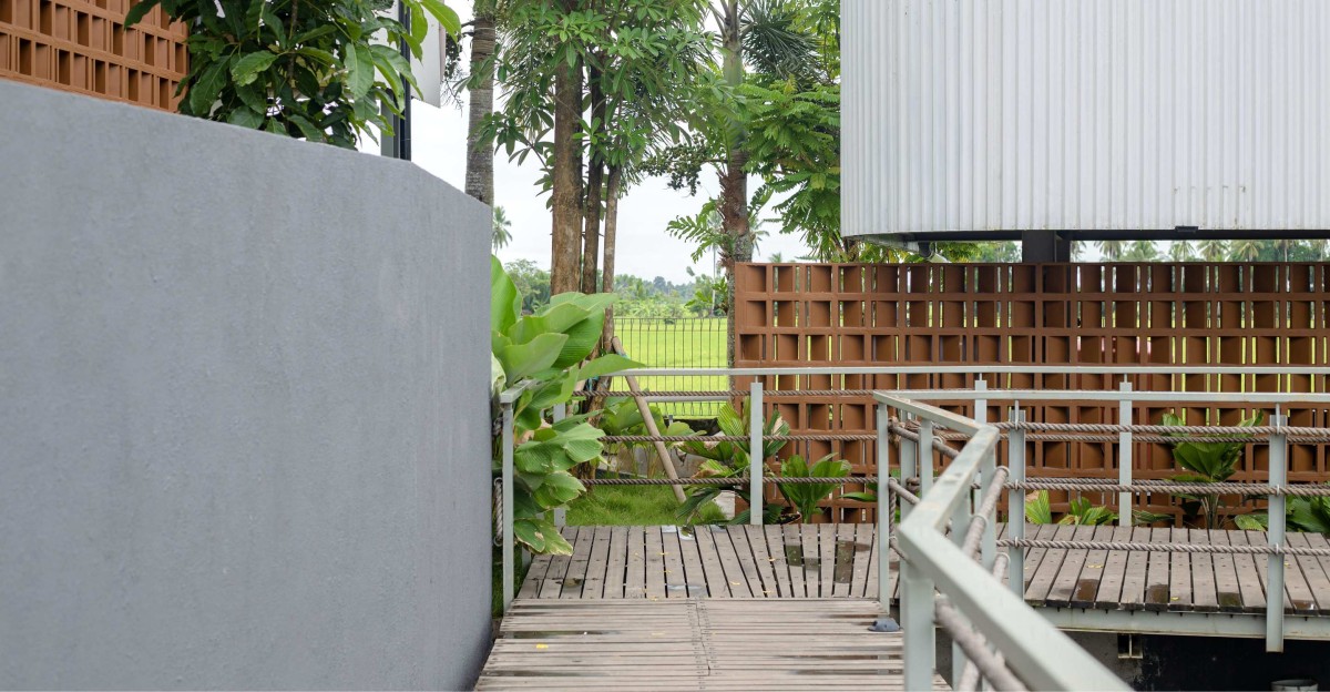 Pedestrian wooden deck of PADI Rest Area by MIV Architects