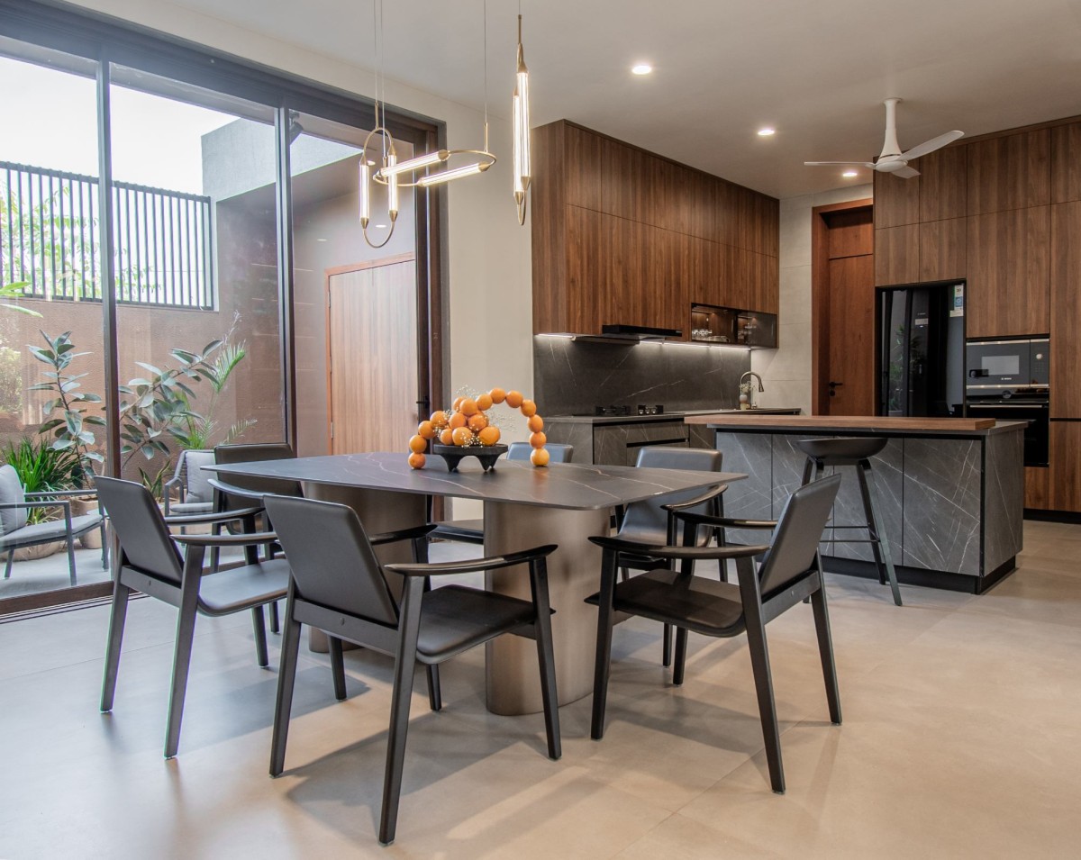 Dining to Kitchen view of J.P. House by Utsav Patel Architects