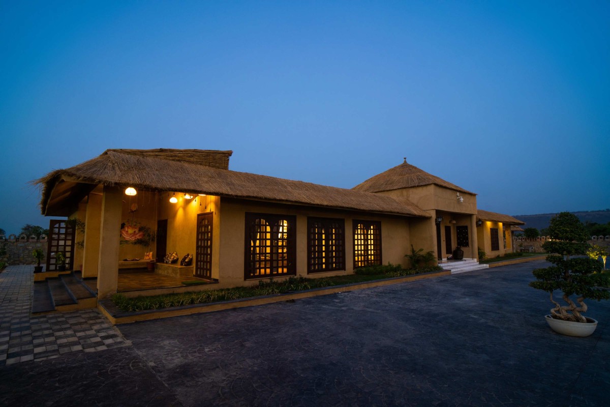 Night exterior view of Shivaray Farms by Studio Shunya