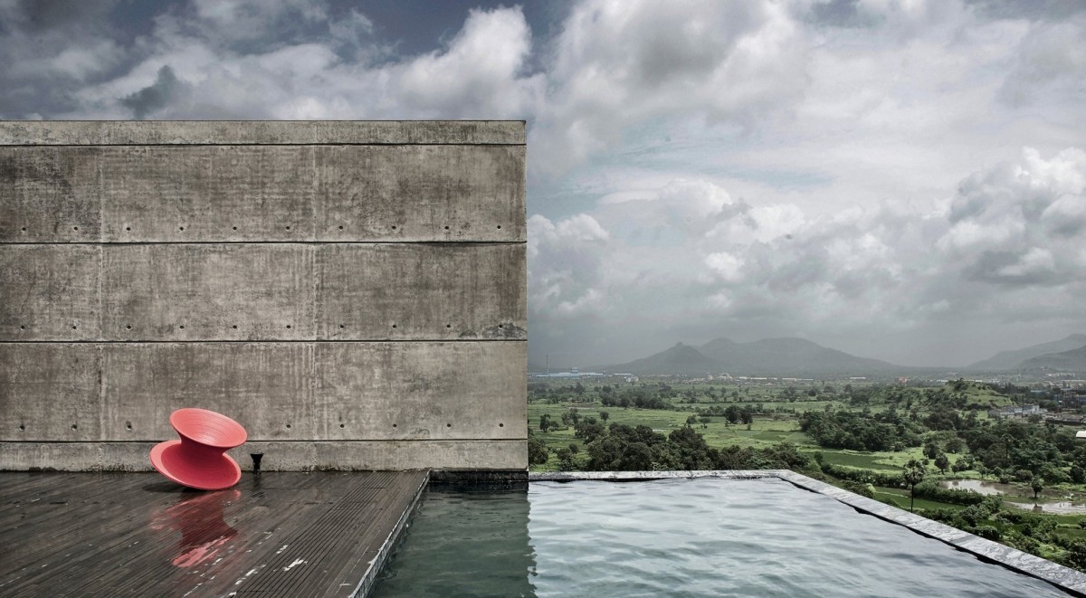 Pool view of The House Cast in Liquid Stone by SPASM Design Architects