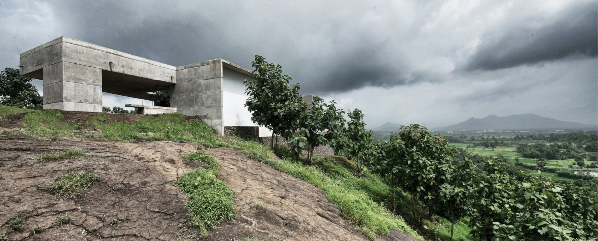 Exterior view of The House Cast in Liquid Stone by SPASM Design Architects