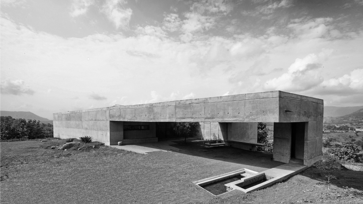 Exterior view of The House Cast in Liquid Stone by SPASM Design Architects