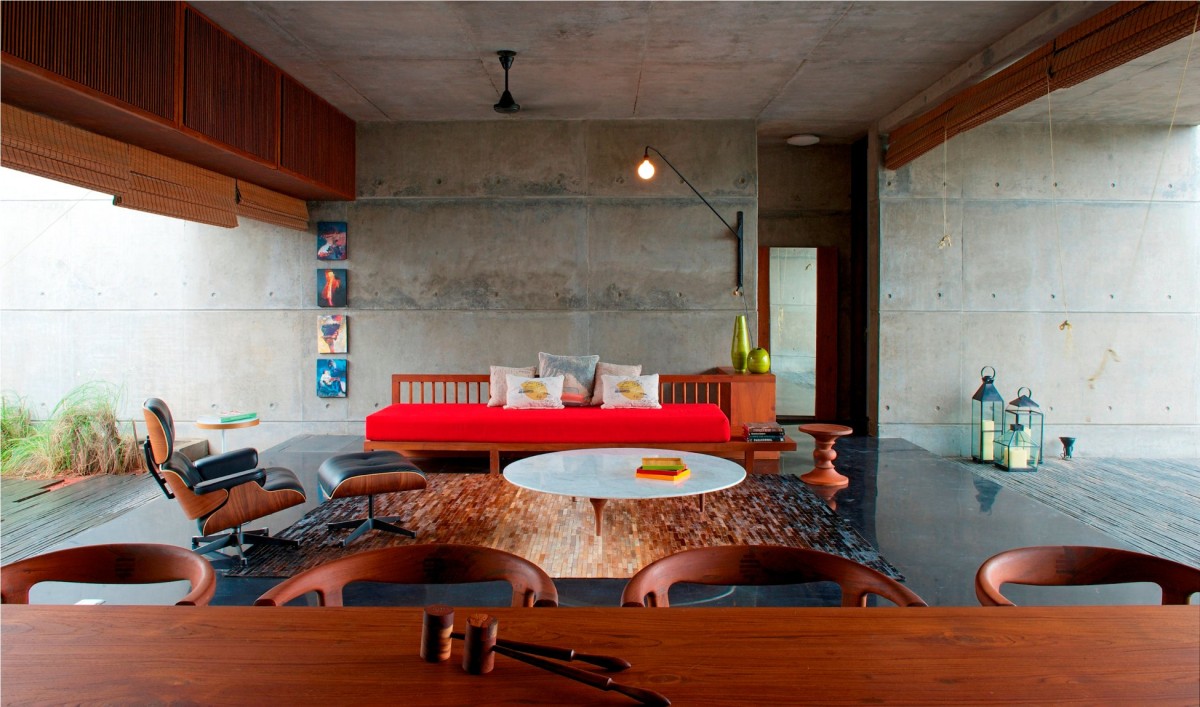 Dinig to Living room view of The House Cast in Liquid Stone by SPASM Design Architects